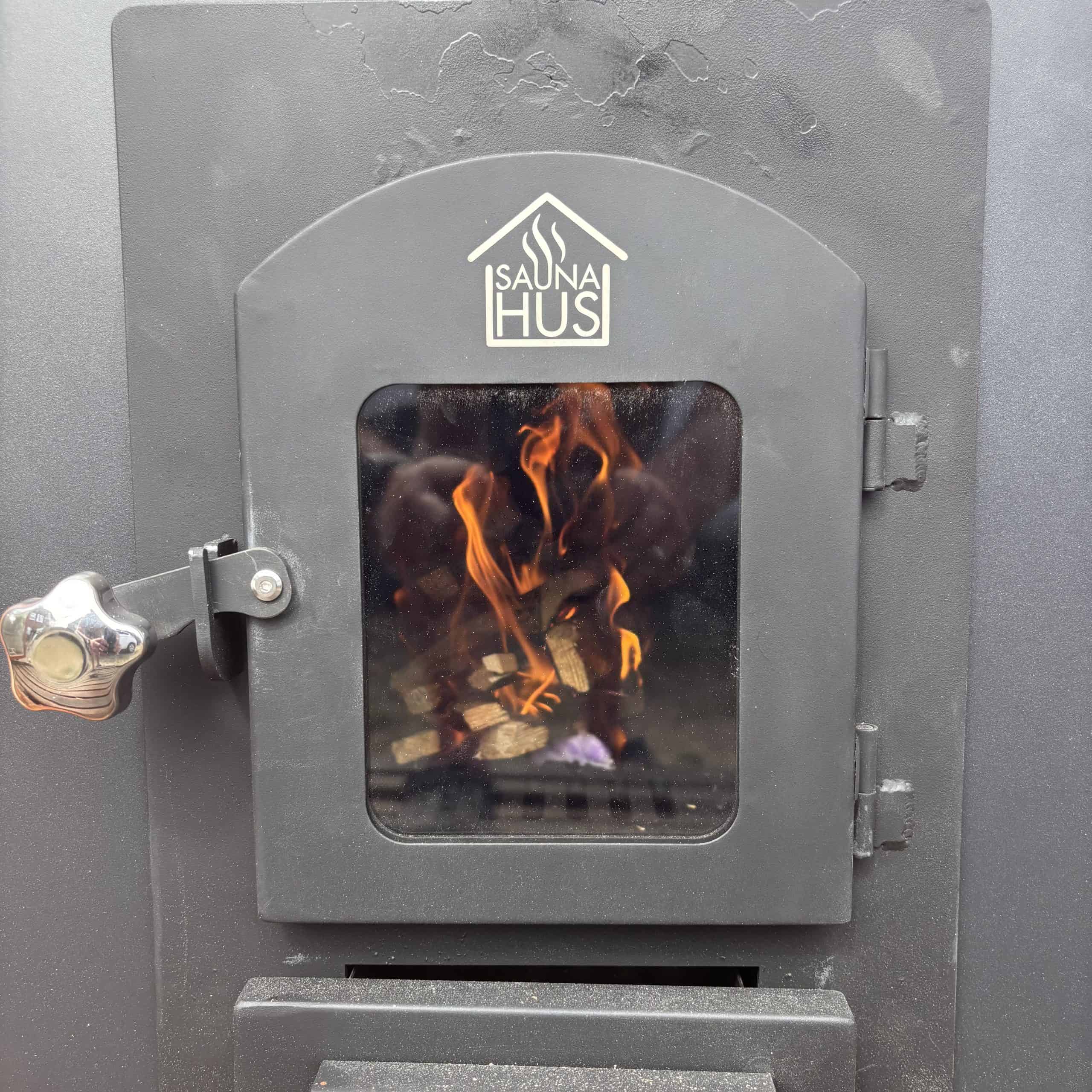 Bespoke wood-fired sauna stove installed in the mobile sauna